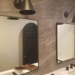 Two bathroom mirrors hung on wall - Art Hangers