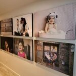 Art Hangers of Orange County professionally hung large family portraits in the hallway of a private residence