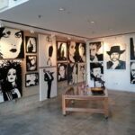Museum of black and white art work hung by At Hangers 